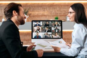 Global team collaboration via video conference showing international software development candidates from multiple countries participating in distributed hiring and outsourcing evaluation.